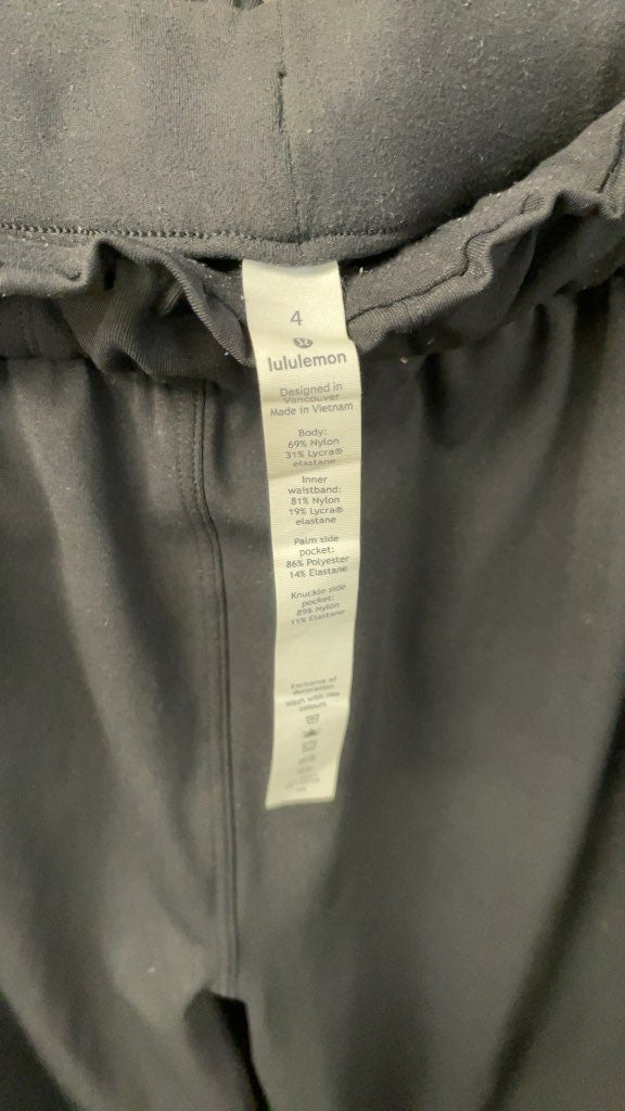 Lululemon Women's Black Ruffled Waist Pants - Size 4